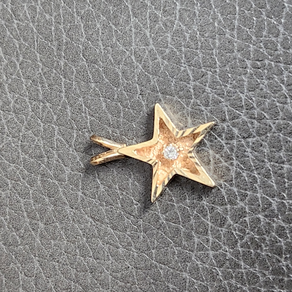 Elegant Gold Star Pendant with Diamond Accent
